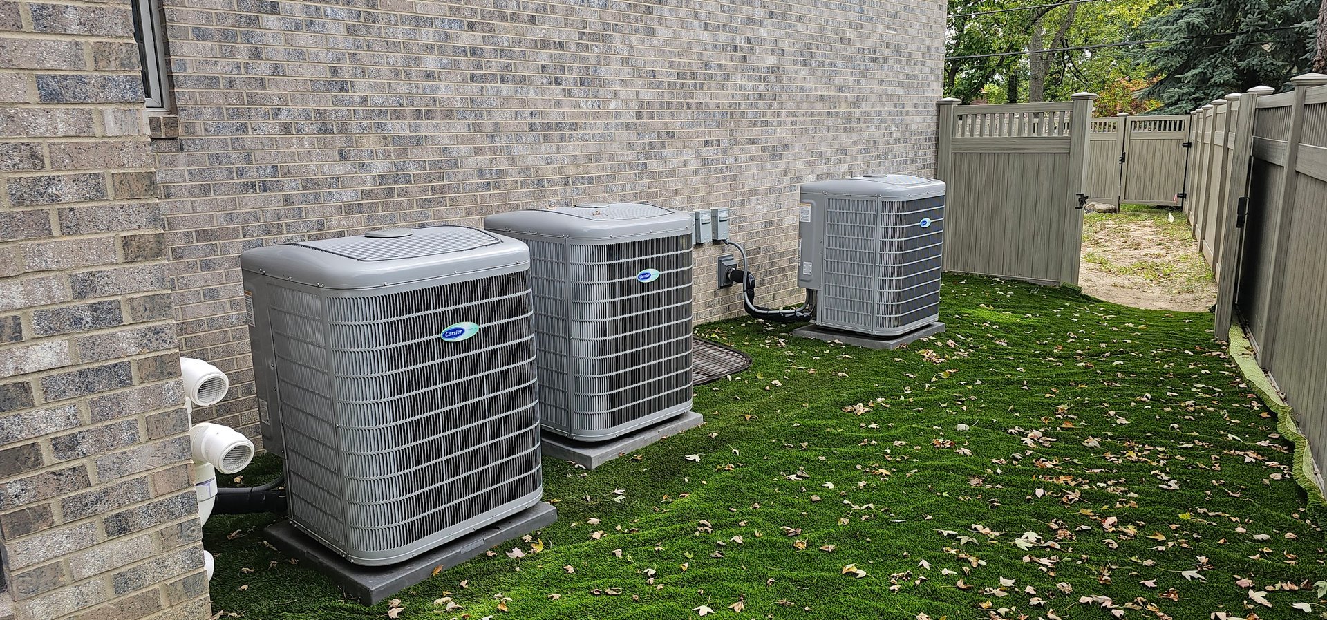 Mechanical Temp Carrier AC condenser installation - residential outdoor unit