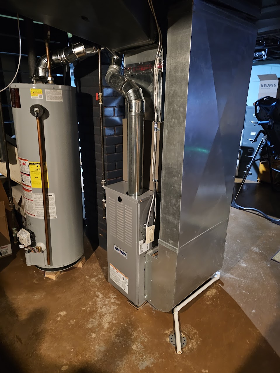 Technician inspecting an older furnace